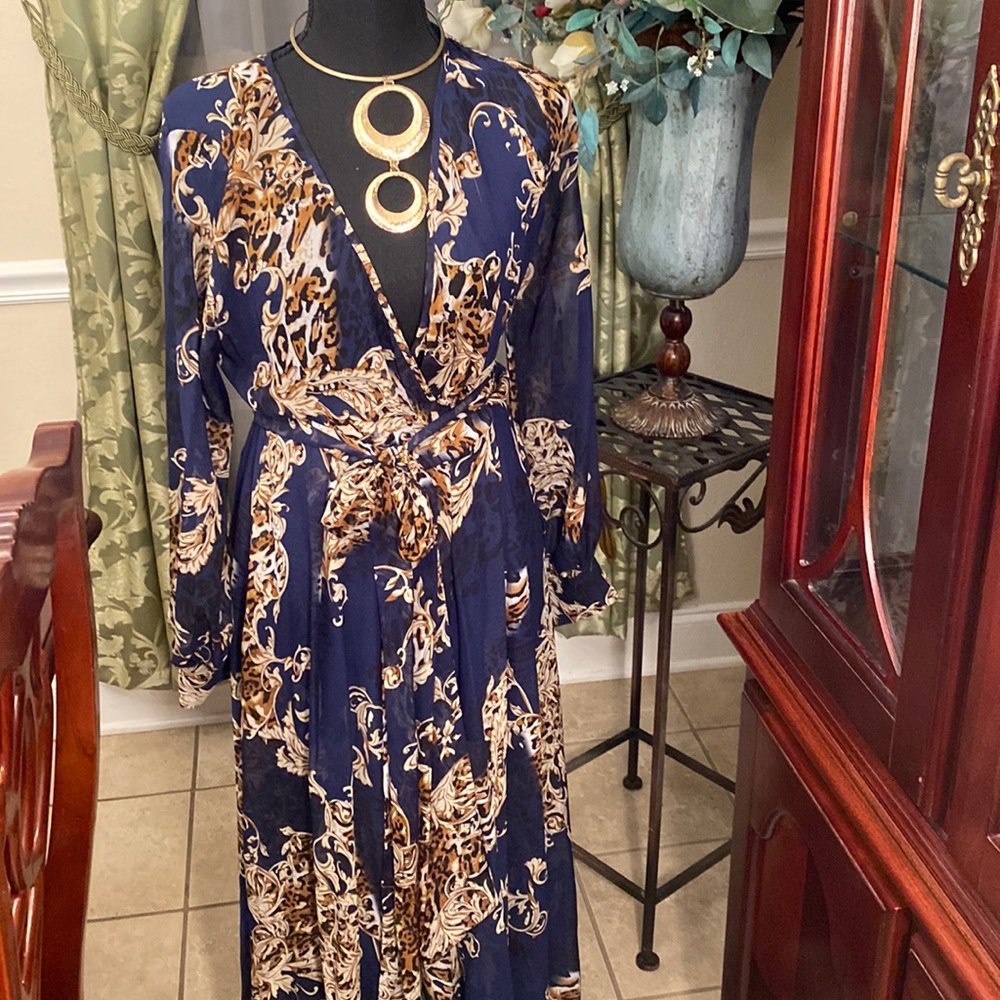Navy blue and cream printed maxi with gold buttons on the sleeves.